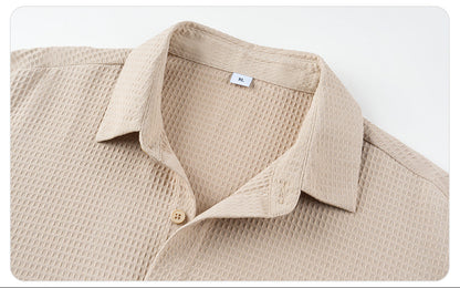 Beige textured shirt with collar on a white background