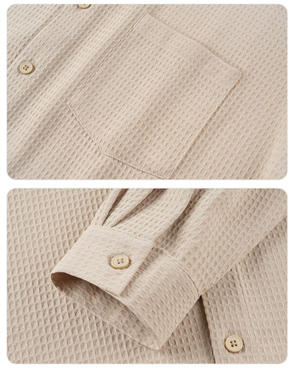 Close-up of beige textured fabric with buttons on a plain background