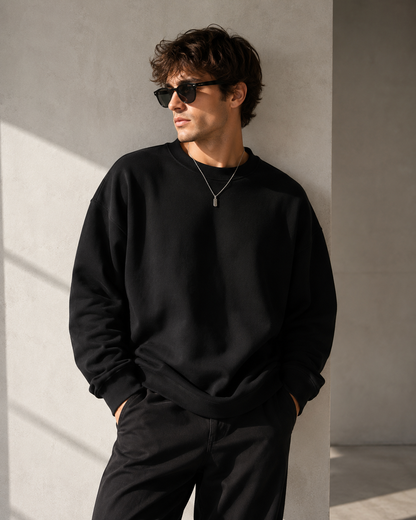 Male model wearing black heavyweight crewneck sweatshirt