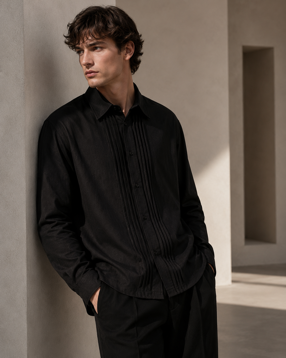 Male model wearing black pleated-placket fashion shirt