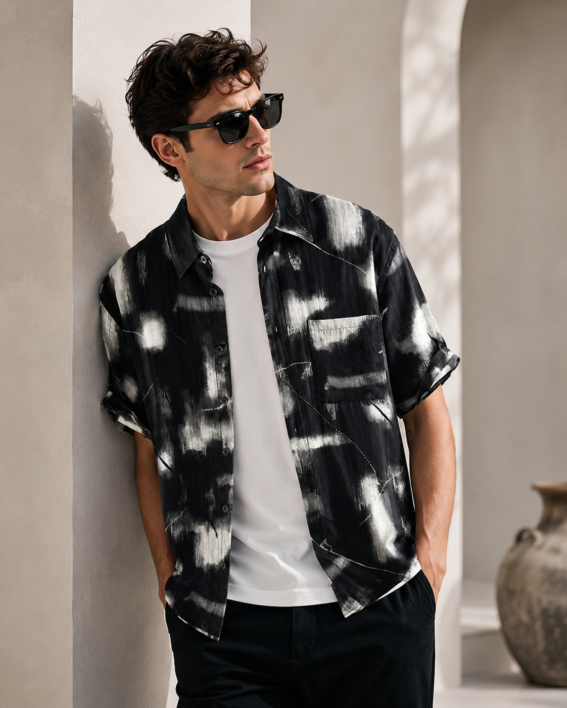 Male model wearing black and white printed short-sleeve summer shirt