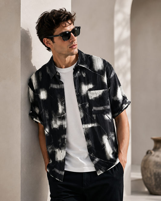 Male model wearing black and white printed short-sleeve summer shirt