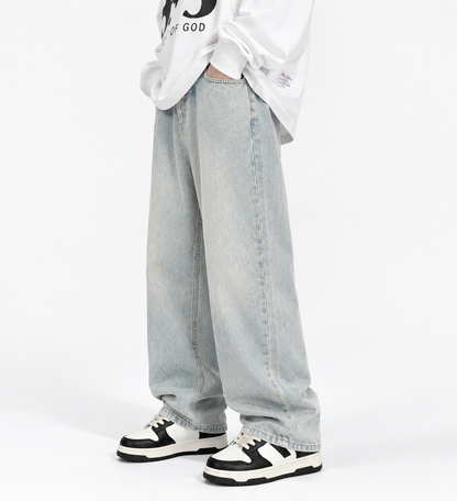 Model wearing light wash Washed Blue Straight-Leg Jeans, front detail view